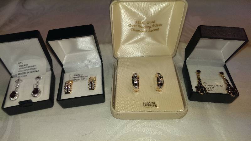 Four pairs of pierced earrings (sterling silver, garnet, cubic zirconia and diamond accents).