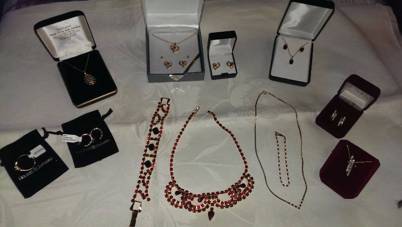 Variety of necklaces, bracelets, earrings, and a ring (some with garnet, ruby, gold or sterling silver).