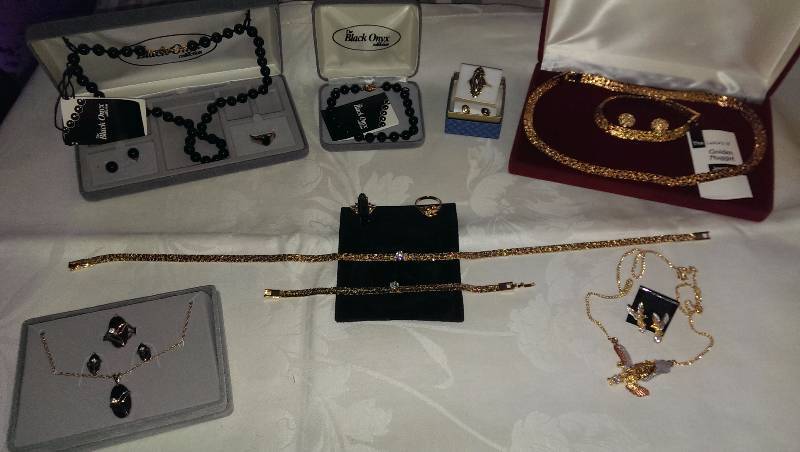 Variety of necklaces, bracelets, earrings, and ring sets. (Some gold and black onyx).