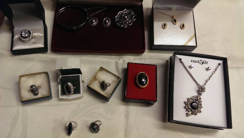Variety of necklaces, earrings, pin and ring sets. (Some sterling silver, hematite, black opal).