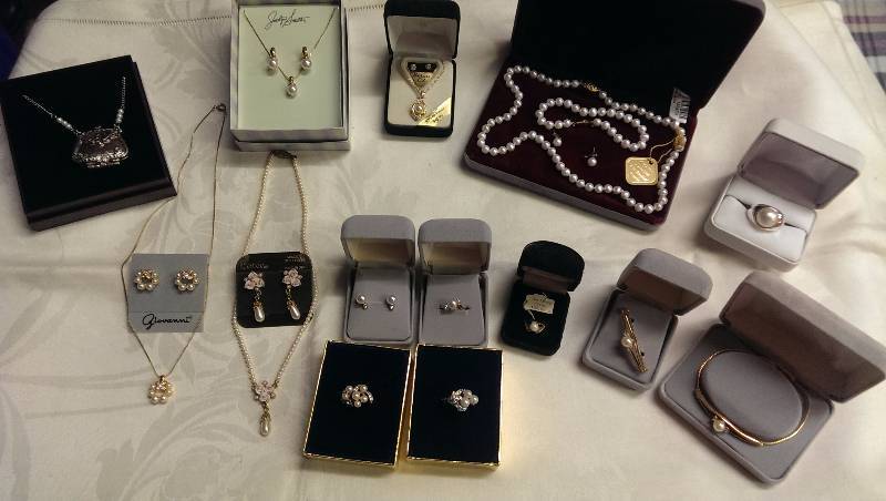 Variety of necklaces, earrings, pin and ring sets. (Some gold and pearl accents).
