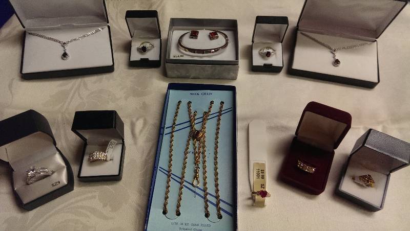 Variety of necklaces, earrings, bracelet and ring sets. (Some gold as well as garnet accents).