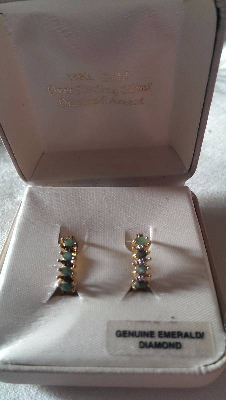 Pierced earrings (18k gold with diamond and emerald accents).