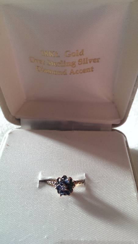 Ring (18k gold with diamond and sapphire accents).