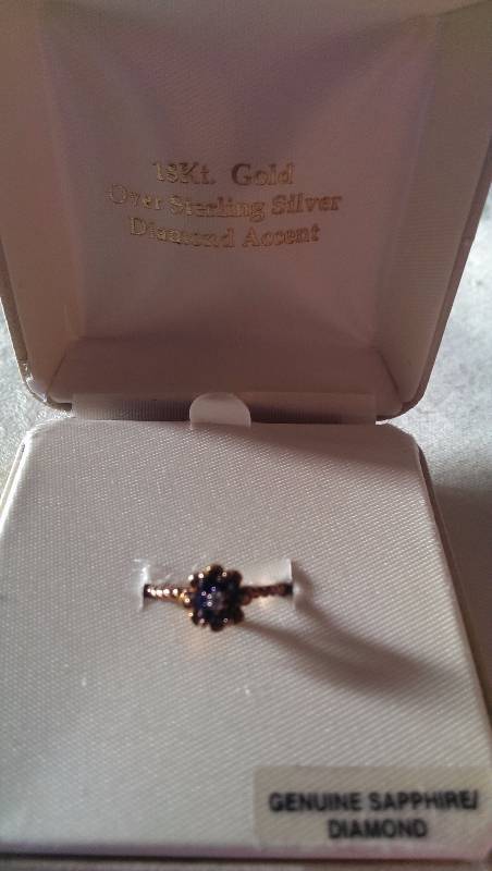 Ring (18k gold with diamond and sapphire accents).