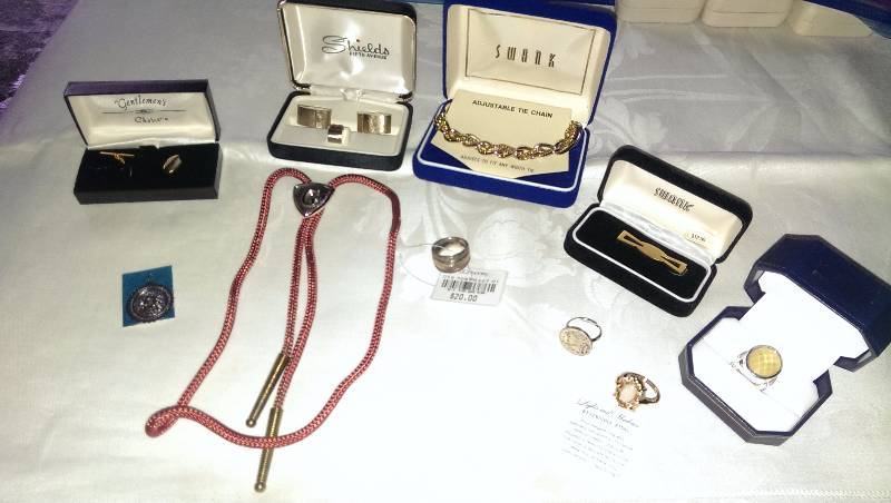 Variety of rings, cufflinks, tie tacks, money clip, bolo tie and misc.