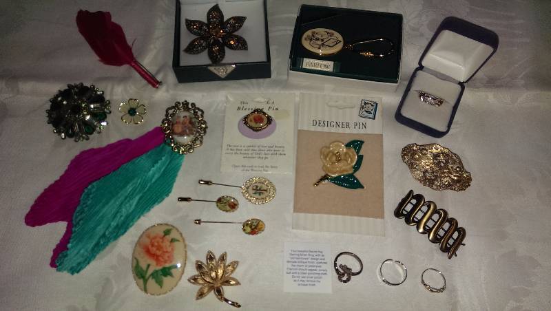 Variety of deco pins, rings, and hair barrettes