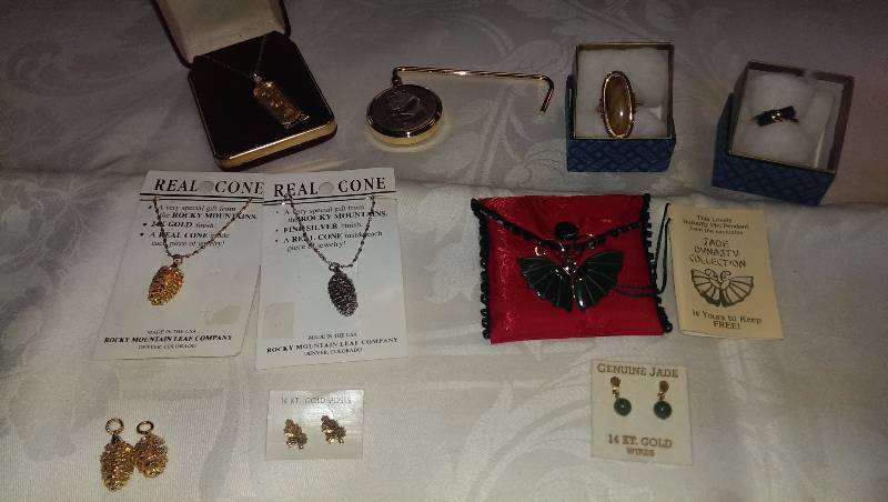 Variety of necklaces, earrings, and ring sets. (Some gold and jade accents).