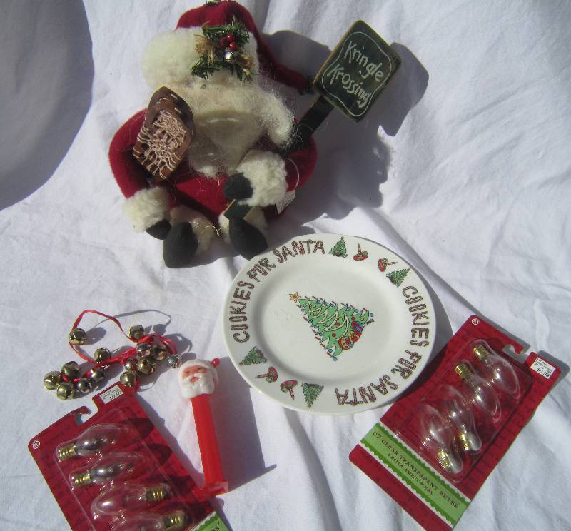 lot 518 image: Christmas Lot - Santa with Snowshoes, Lights, Santa Pez and Cookies for Santa Plate