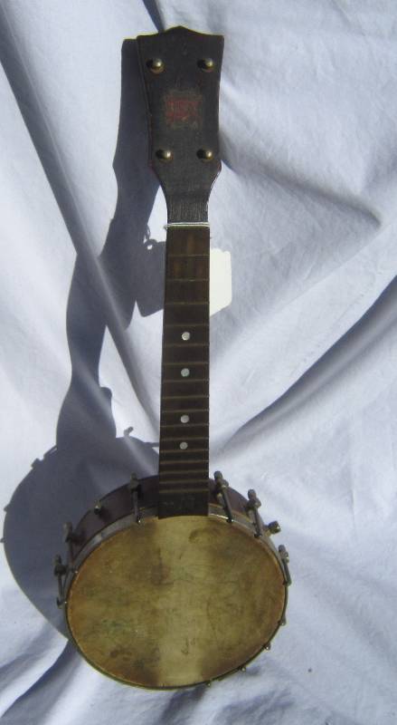 lot 625 image: Vintage Pony Banjo with artistic work on hide.