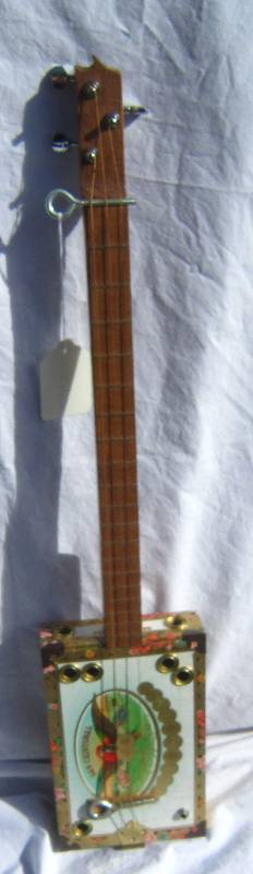 lot 644 image: Cigar box Electric Guitar