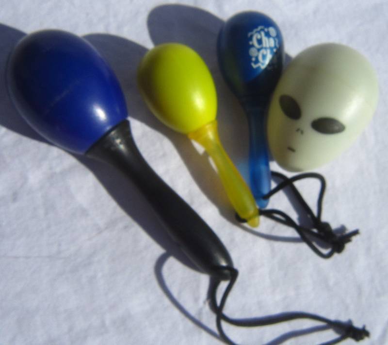 lot 659 image: (3) Maraca egg shakers and (1) egg shaker.