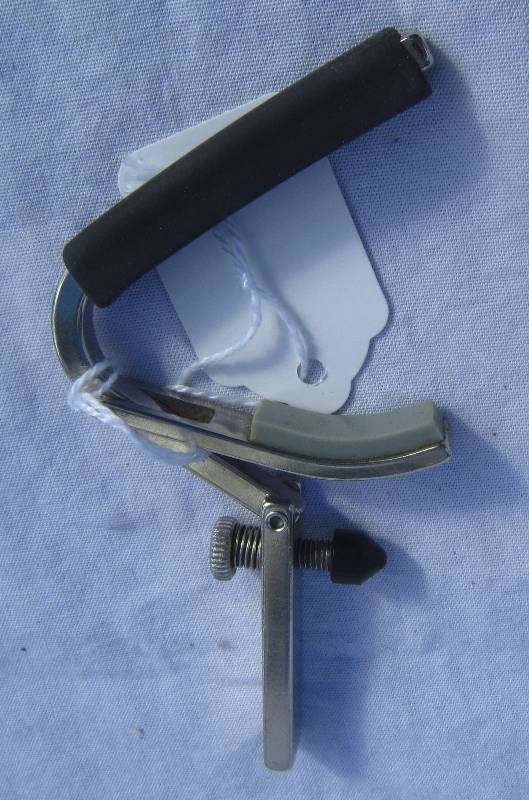 lot 690 image: Silver Shubb Guitar Capo