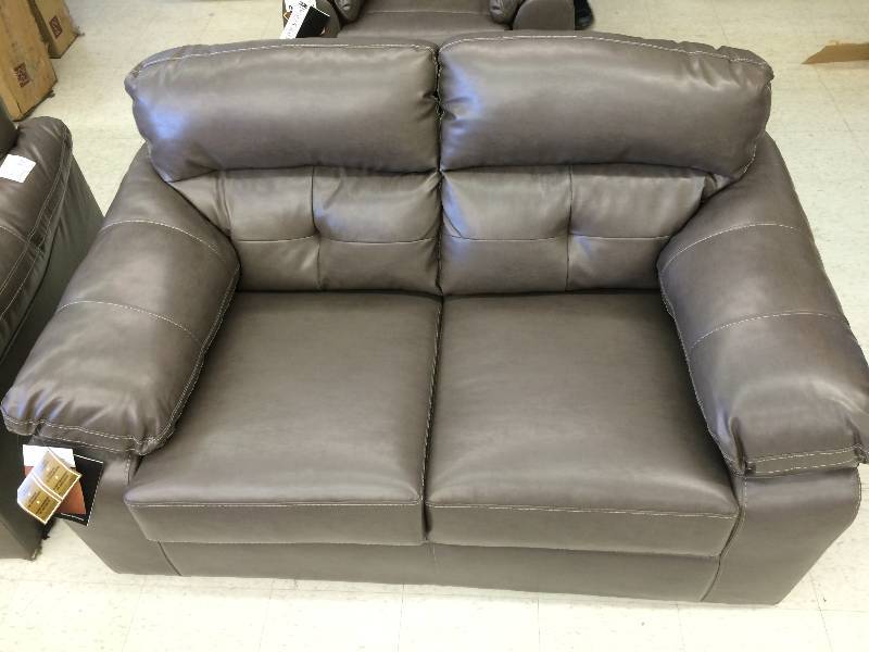 New Ashley Loveseat Gray retail $599      matches lot 28 and 30