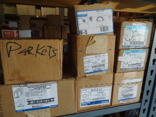 Shelf of Metal Boxes, Covers Etc..