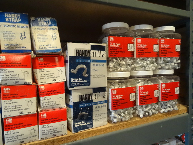 Shelf of Plastic NM Staples