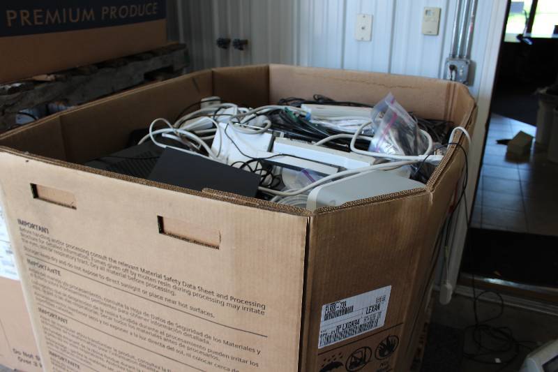 lot 24 image: Gaylord Box Lot of Used Electronics Including Surge Protectors, Ipod Dock, Printer, And More 375lbs Total Weight.