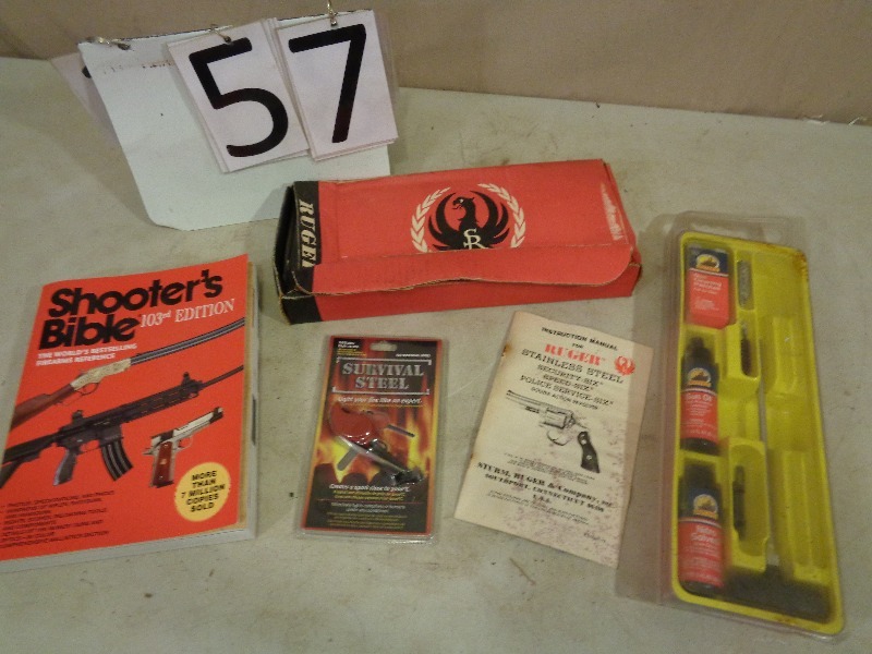 lot 57 image: Gun Cleaning Kit, Ruger Box, Gun Book and More