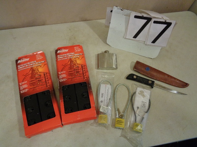 lot 77 image: Berkley Rod Racks, Filet Knife, Gun Locks, and More