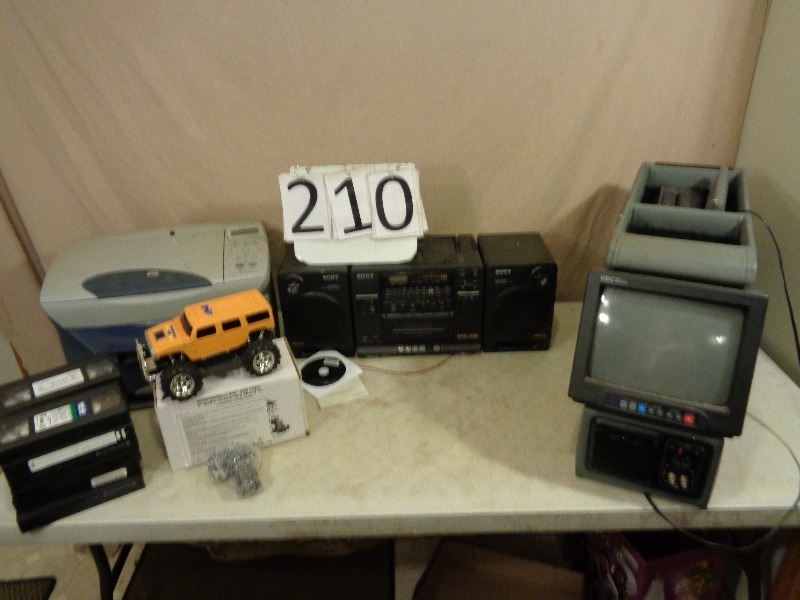 lot 210 image: Printer, TVVHS Car Console, Remote Control Hummer, and More