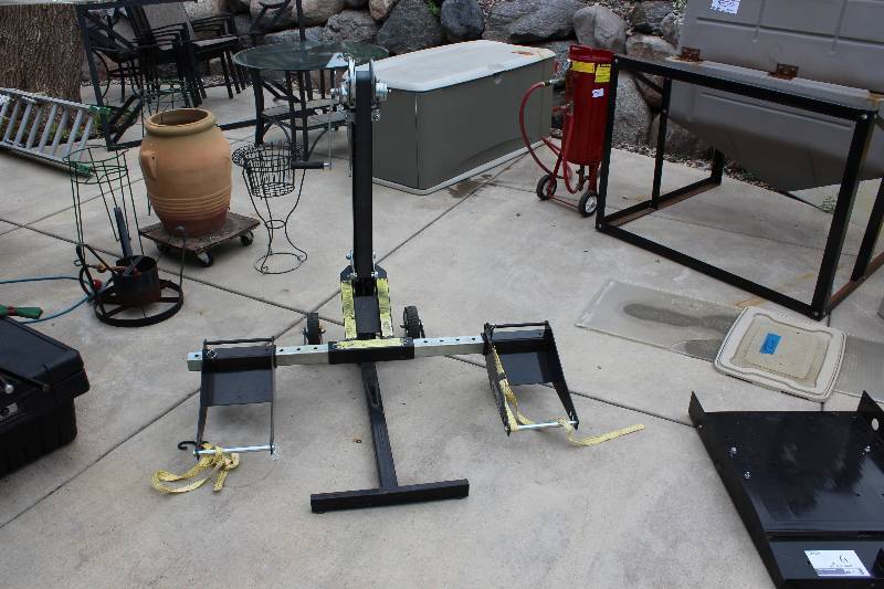 lot 9 image: MoJack Lawn Mower Lift Model MoJack EZ 300lbs, with work table accessories.