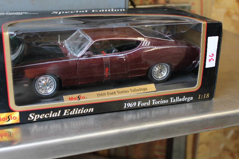 lot 12 image: Maisto 1969 Torino Talladega 118 Size Replica Car In Original Box, Very Rare.