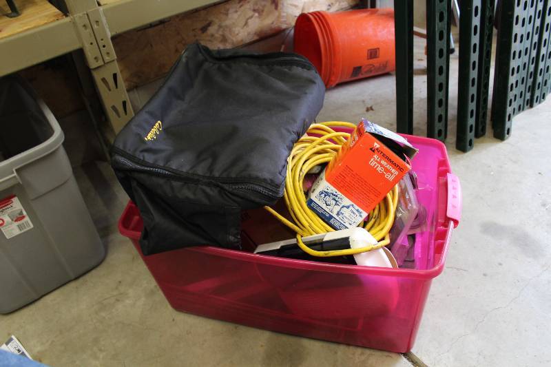 lot 85 image: Container Lot Including Battery Powered Light Extension Cord Carrying Case And More.
