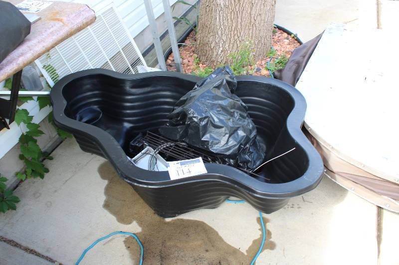 lot 114 image: Plastic Pond Insert Including Contents 56 X 39 X 18.