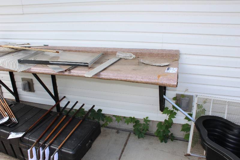 lot 113 image: Great wall mount work bench, with steel frame  needs new top RequiresTools For Removal 26 x 96.