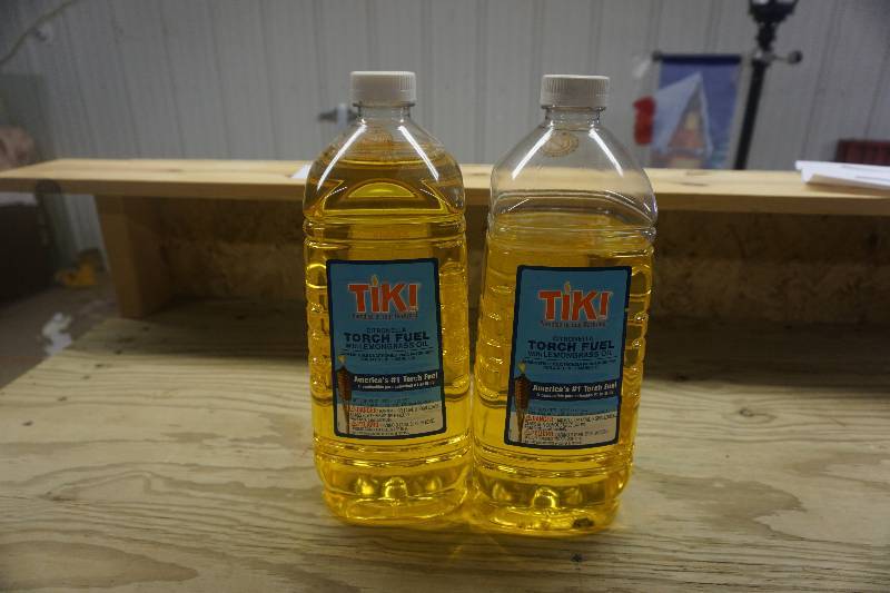 lot 137 image: Lot of 4 Metal Tiki Torches and Torch Oil