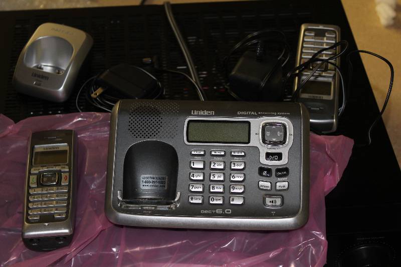 lot 111 image: Uniden dect 6.0 cordless phone, 2 phones, 2 bases. Tested and operational