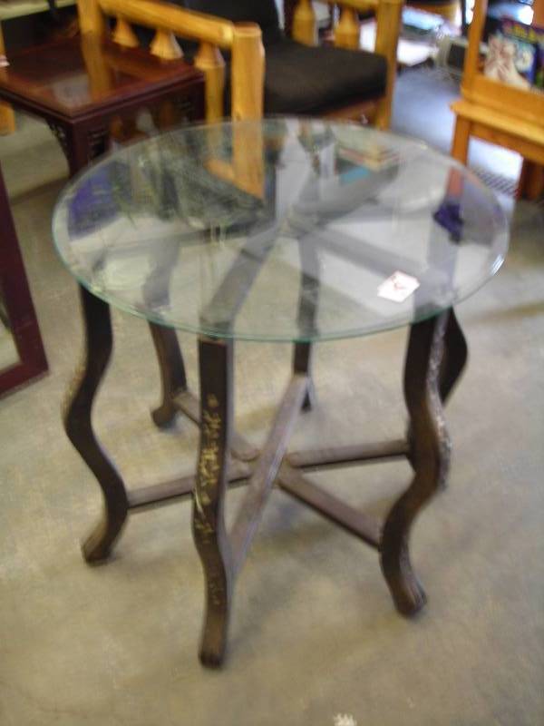 lot 18 image: 32 Inch Glass Top Table With Unique Base