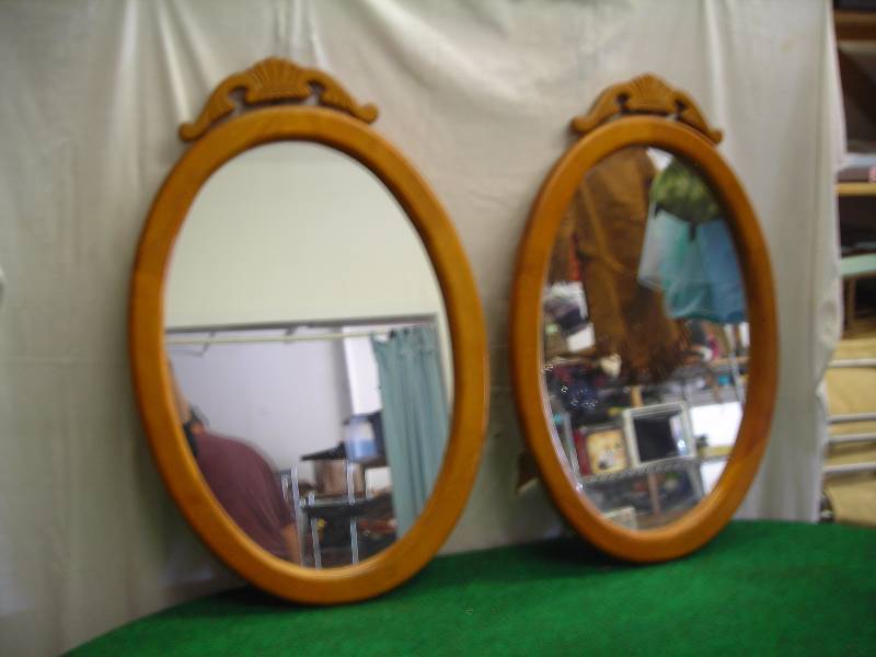 lot 53 image: Pair Of Oval Mirrors With Wood Frame