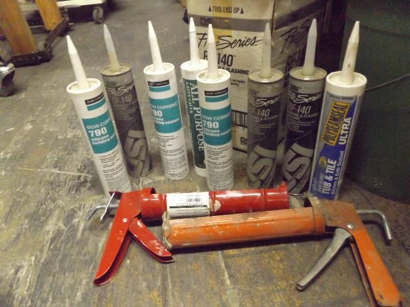 lot 270 image: Caulking Guns with tubes of caulk