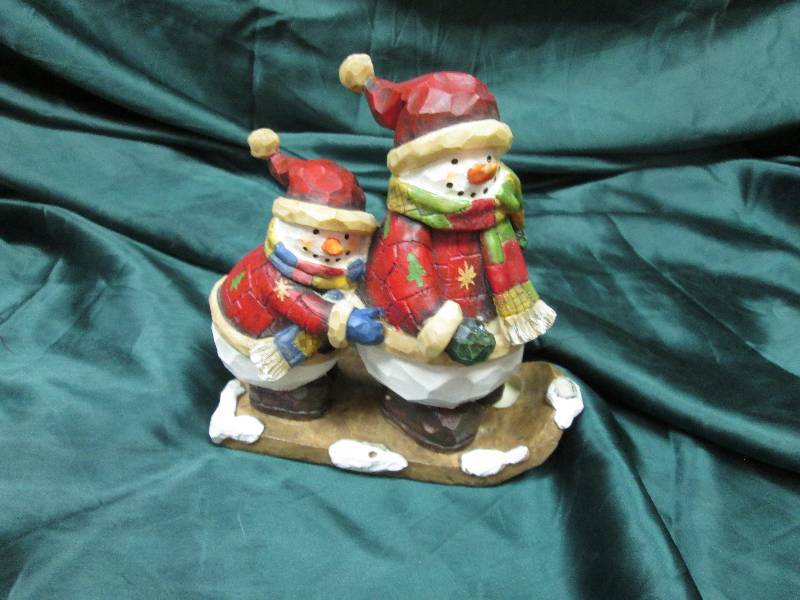Snowmen on a sled...