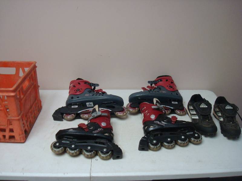 Milk Crate With Two Pairs Of Roller Blades And A Pair Of Cleats