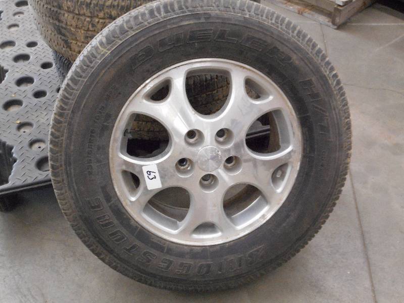 lot 63 image: (4) Bridgestone Dueler HT P23565...