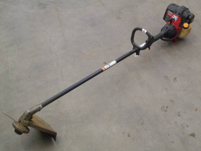 lot 23 image: Troy-Bilt 4-Cycle Grass Trimmer, Ru...