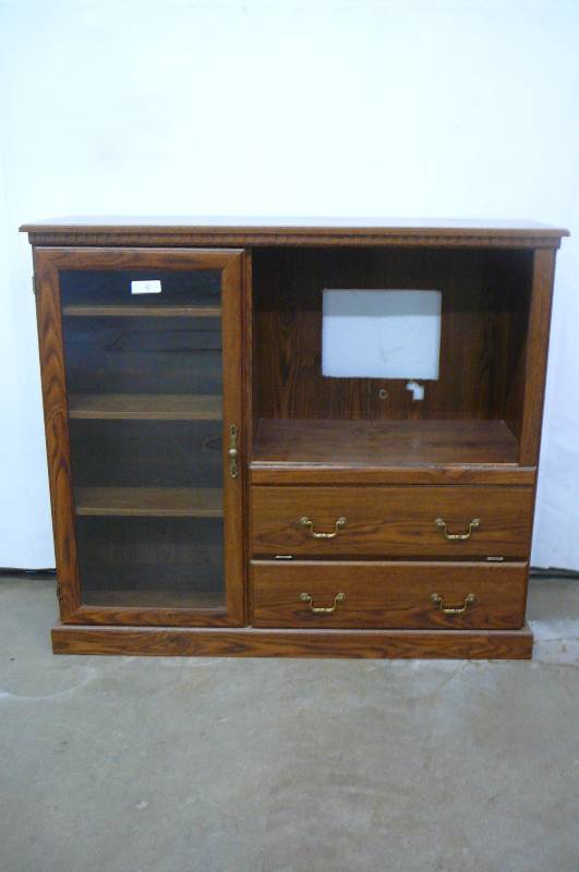 lot 8 image: Oak Entertainment Center with glass side and 2 drawers 50wide X 17 deep X 44 high