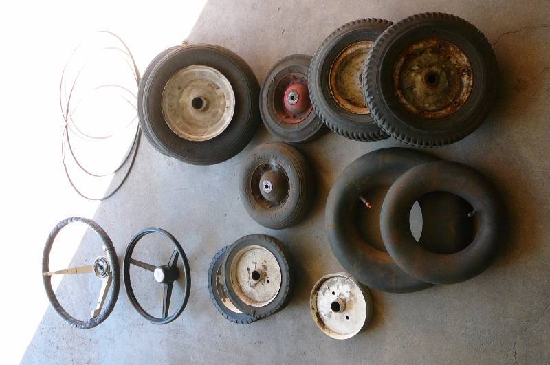 lot 38 image: Lot of Tires, Tubes, Rims, Shift Cable, Steering Wheel, Mustang Steering Wheel