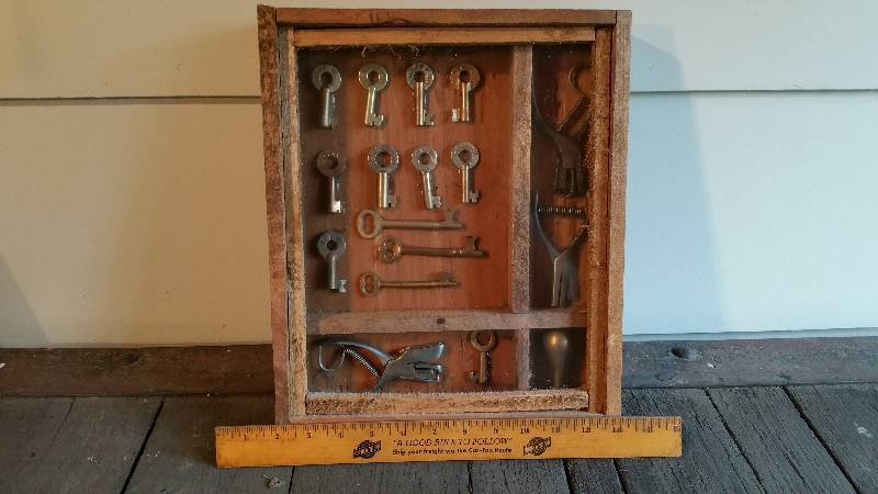 lot 8 image: Railroad Memoribilia Shadowbox - Keys, Wax Stamps, Ticket Punchers
