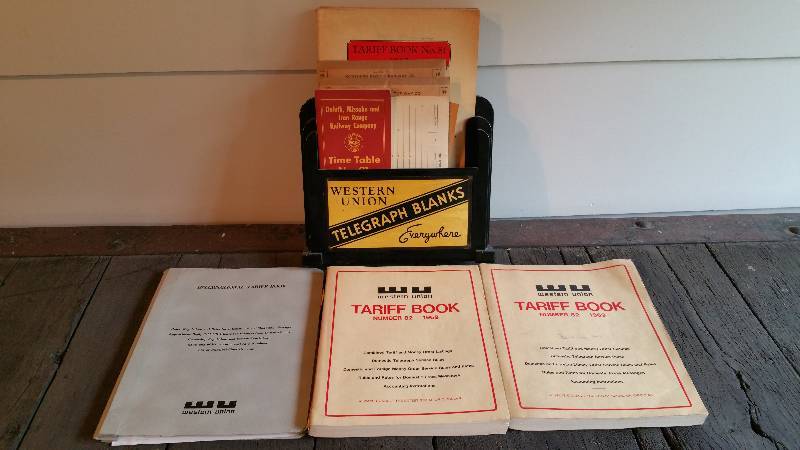 lot 60 image: 1960s Western Union Rack w Forms and Tariff Books