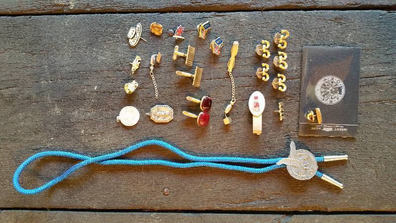 lot 189 image: Collection of Lapel Pins, Cuff Links, Bolo Tie