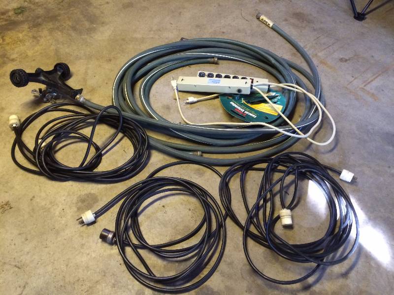 lot 374 image: Electrical Cords, Two Power Strips and a Garden Hose