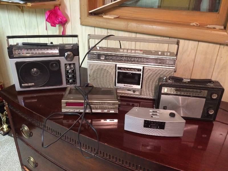 lot 381 image: Four Vintage Portable Radios and One Clock Radio