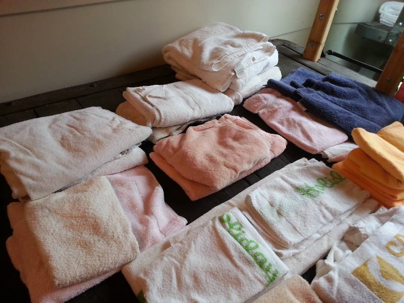 lot 404 image: Lots of Towels, Chamois, Garbage Bags, Etc.