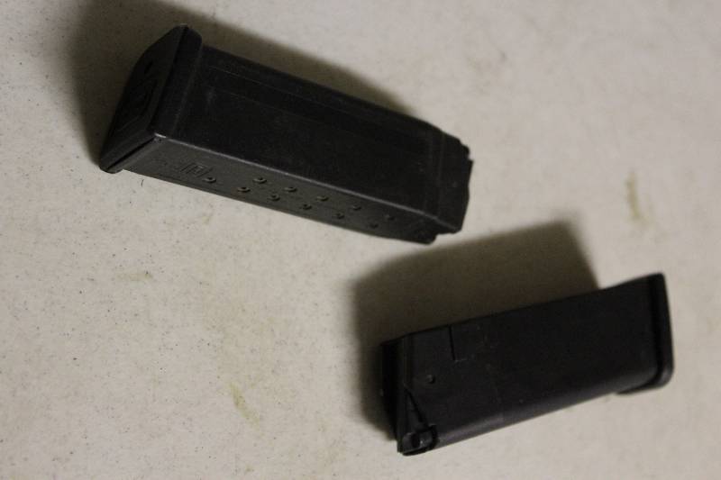 lot 78 image: Lot of (2) Glock 17 Round 45 ACP Magazines.