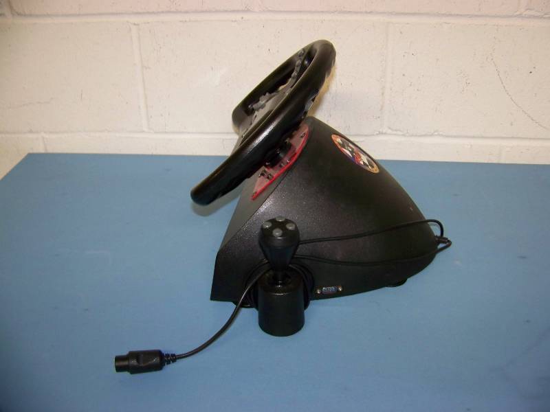 lot 16 image: Mad Catz Racing Steering Wheel and Gas  Brake Pedals for Nintendo 64
