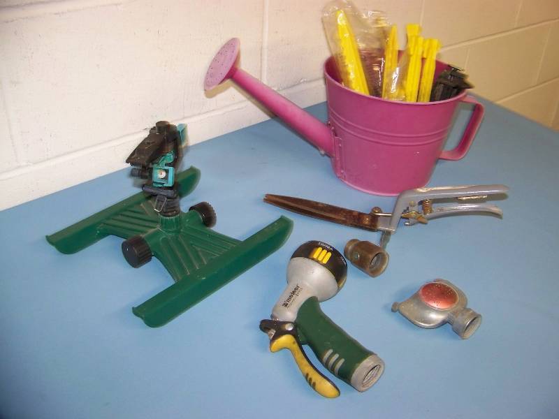 lot 26 image: Sprinklers, a Watering Can, Gardening Stakes and Clippers