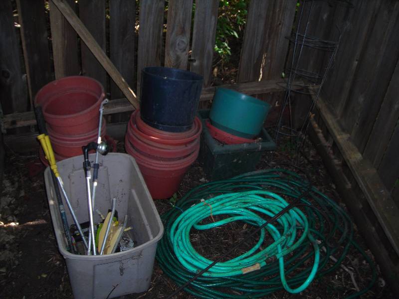 lot 134 image: Garden Hoses, Sprinklers, Tomato Cages, More